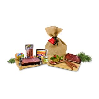 Schwarzwälder Schinken, 1 Glas Leberwurst, 4 Landjäger, dazu Senf und Vollkornbrot verpackt im Jutesack mit weihnachtlichem Anhänger.